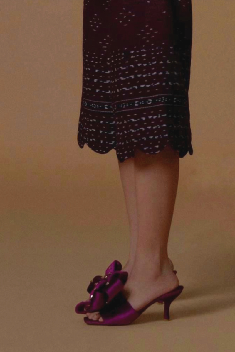Christin Wu Raina fuchsia bow heels, stylish women's footwear with a vibrant pink color and elegant bow detail, on a lifestyle background