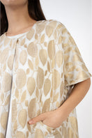 Shatha Essa gold coat dress with detailed fabric and stylish design, perfect for elegant occasions.