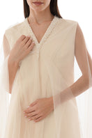 Close-up of a pearl-embellished drape detail on a SHATHA ESSA gown, showcasing elegant embroidery and luxurious fabric.