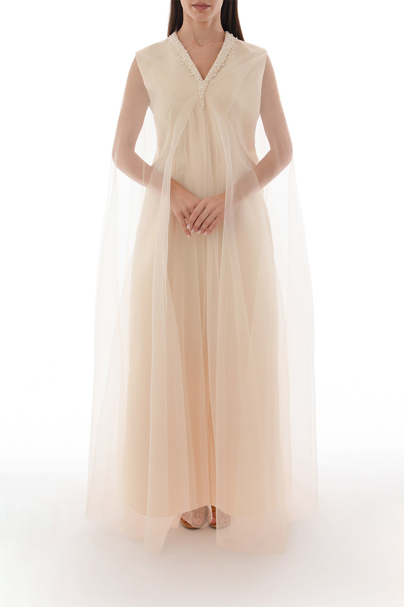 Pearl-embellished drape detail cape dress by Shatha Essa, featuring elegant gown design with flowing fabric and intricate embellishments.