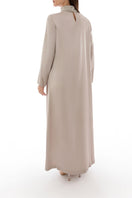 Back view of Shatha Essa crystal-embellished collar detail maxi dress, showcasing elegant design and flowing fabric.