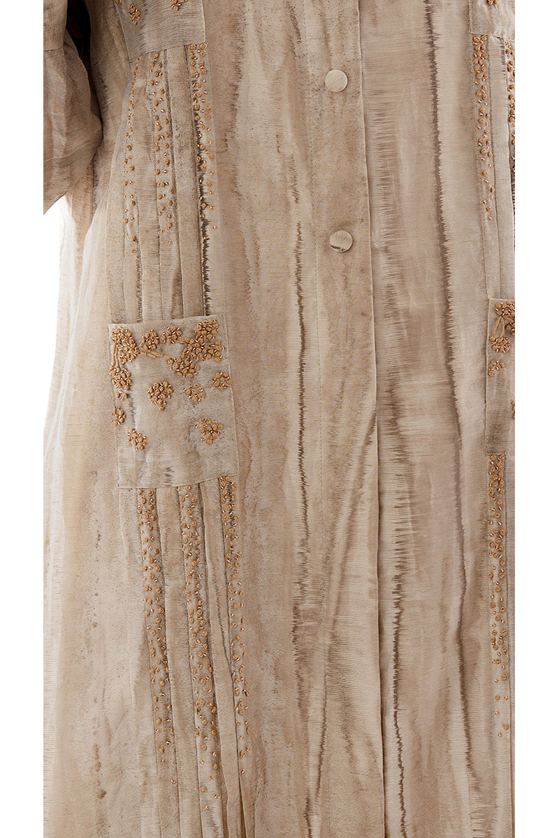 Embroidered shirt dress with detailed accents, long maxi dress by Shatha Essa featuring intricate embroidery and stylish design.