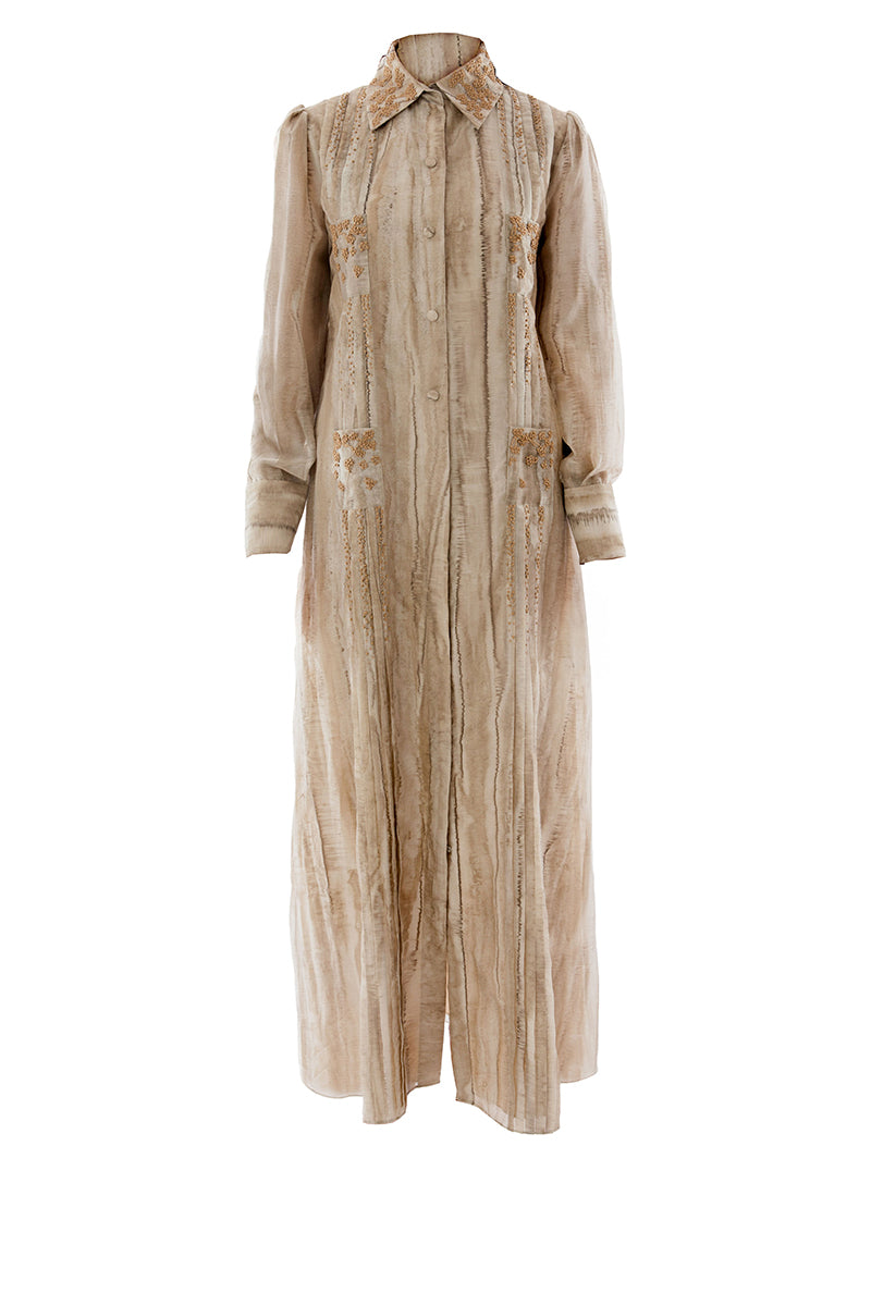Embroidered Shatha Essa maxi shirt dress with intricate detailing, featuring a flowing silhouette and elegant design.