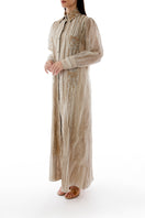 Side view of a SHATHA ESSA embroidered maxi shirt dress with detailed stitching and a relaxed fit.