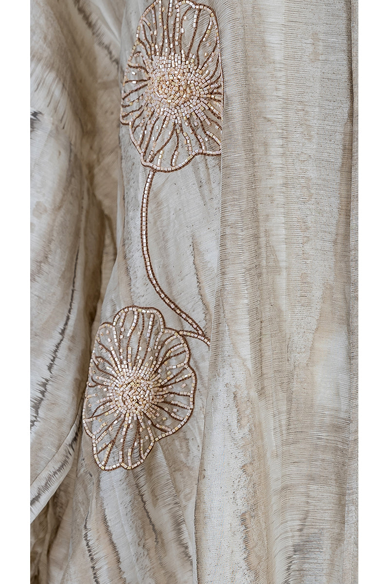 Floral embroidered oversized shirt dress with inner dress by Shatha Essa, featuring a maxi length and detailed floral embroidery.