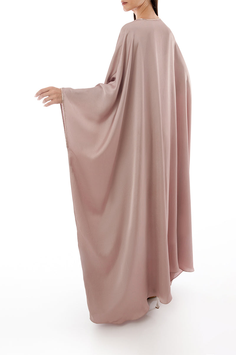Back view of SHATHA ESSA tassel detail embellished caftan maxi dress with intricate embroidery and flowing fabric.