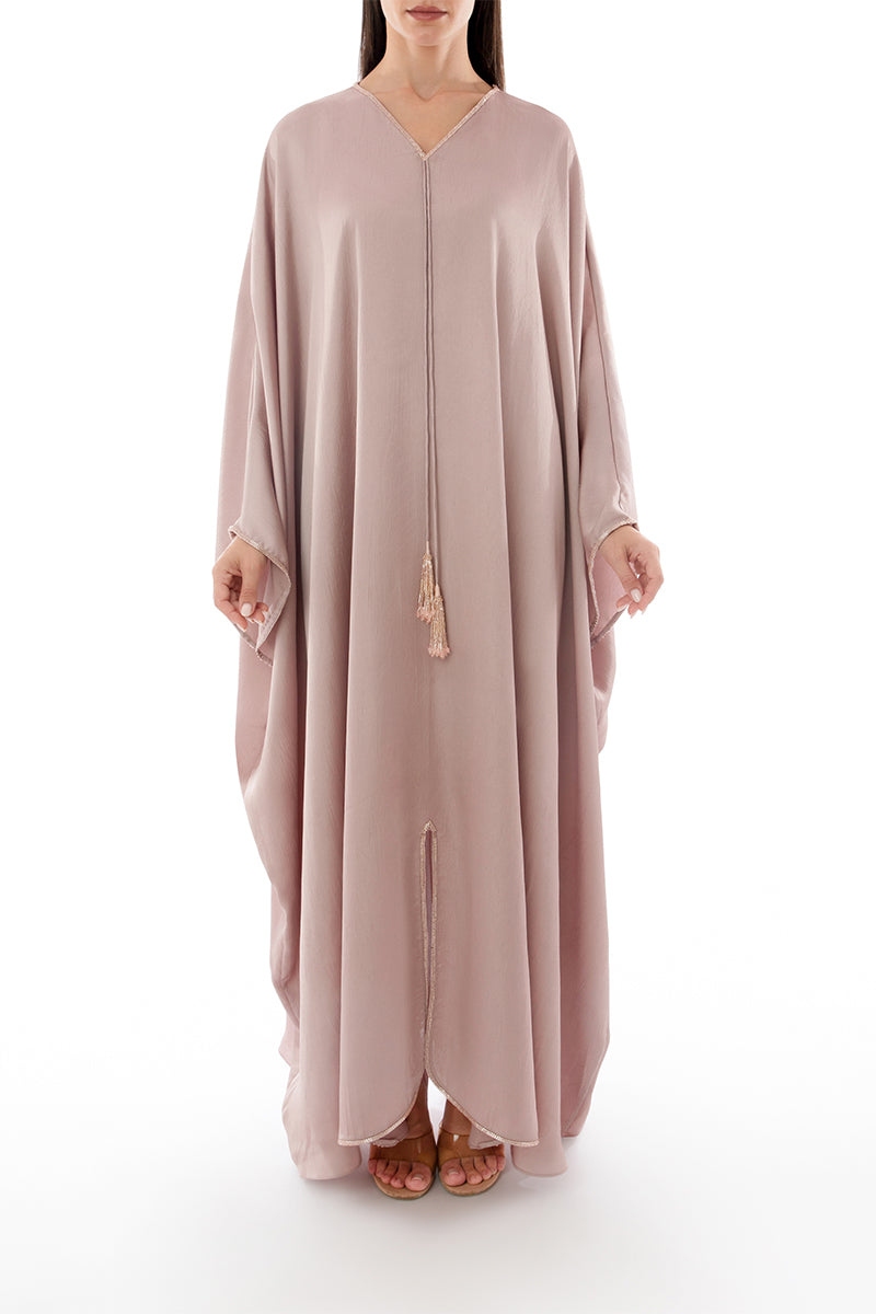 Shatha Essa tassel detail embellished caftan maxi dress in vibrant fabric, front view showing intricate beadwork and flowing design.