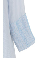 Embroided side slit detail maxi dress by Shatha Essa with inner dress, flowing fabric and elegant design.