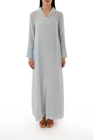 Front view of a SHATHA ESSA embroidered maxi dress with side slit detail and inner lining, showcasing elegant design and intricate embroidery.