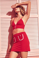 Talia Collins red terry bralette and pocket skirt co-ord set, featuring a matching top and skirt in soft terry fabric.