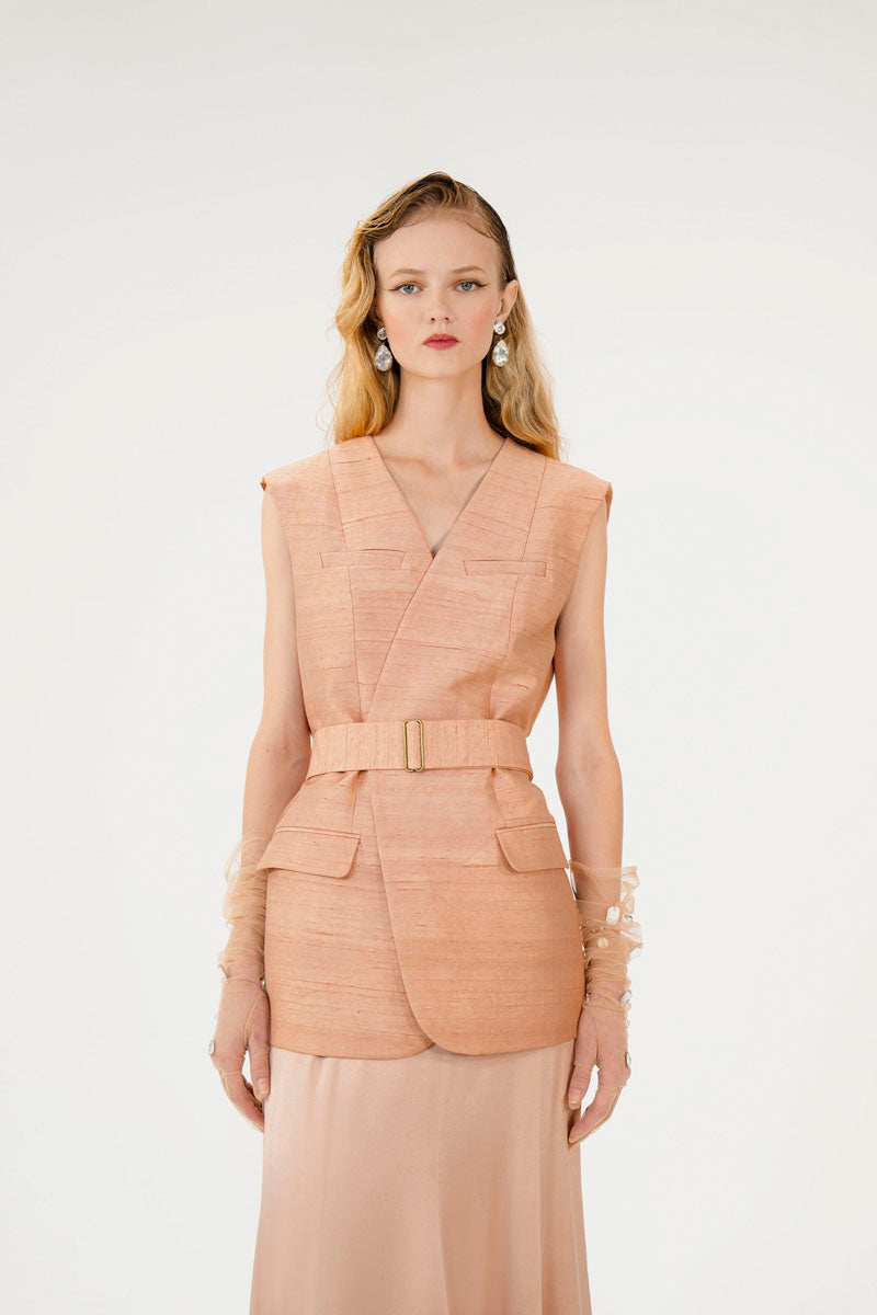 Mastani Reez Silk Gilet in nude, stylish sleeveless vest with smooth silk fabric, displayed on a neutral background.