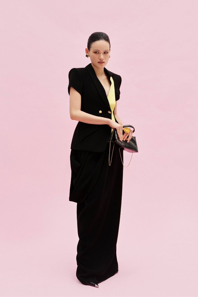 Jenny K Tran Reigate blazer jacket displayed on a hanger, showcasing tailored fit and classic design.