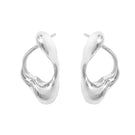 Silver RENASER earrings by Eugenia Ospina featuring intricate design and polished finish, displayed on a neutral background.