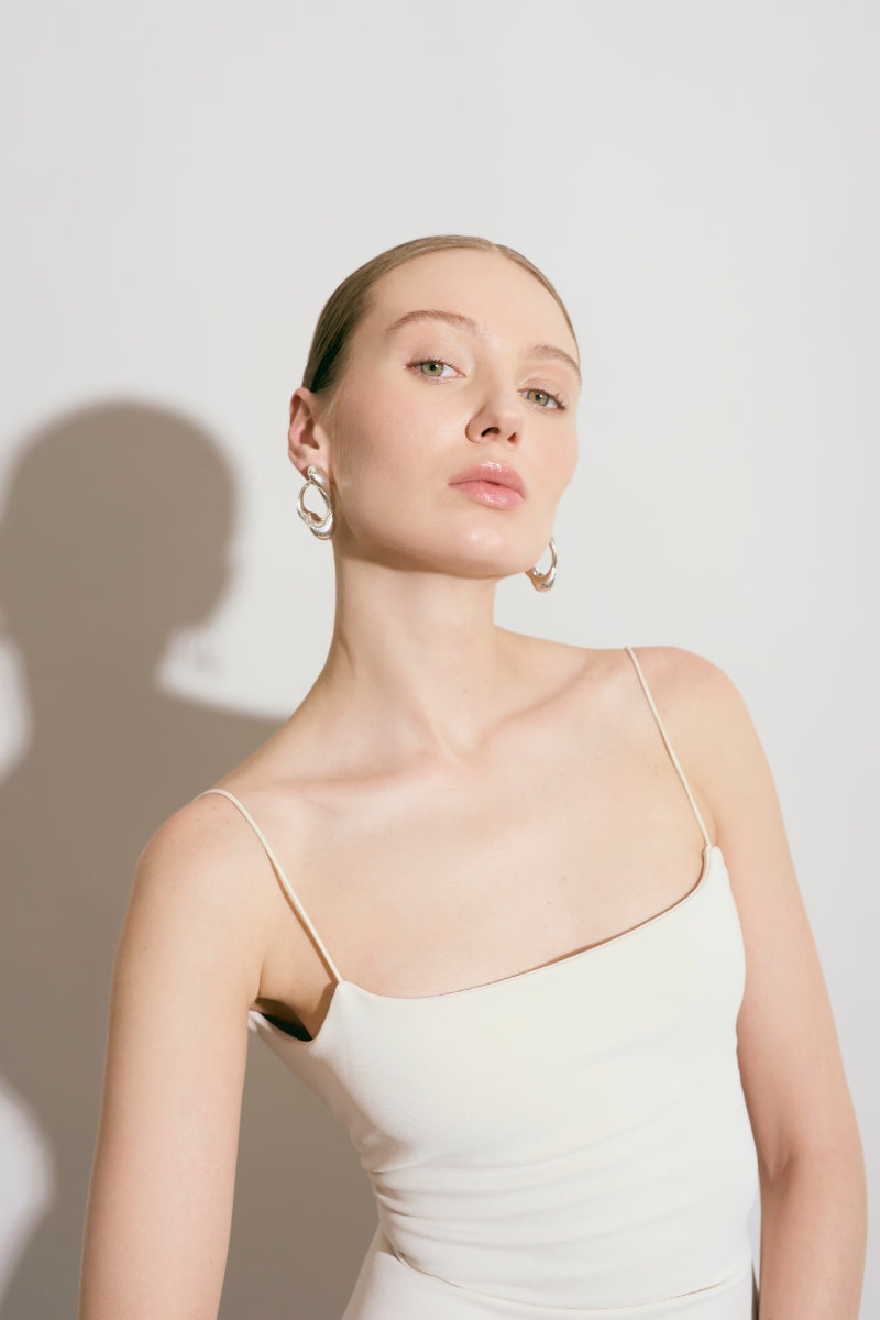Silver Renaser earrings by Eugenia Ospina featuring sleek, modern design with polished silver finish.