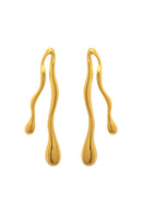 Gold earrings with a sleek, modern design from Eugenia Ospina's Respira collection, shown in a close-up image.