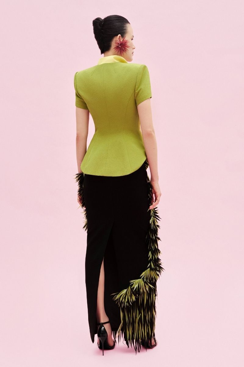 Green Jenny K Tran Retford Maxi Skirt displayed with flowing fabric and a stylish, comfortable design for casual or dressy wear.
