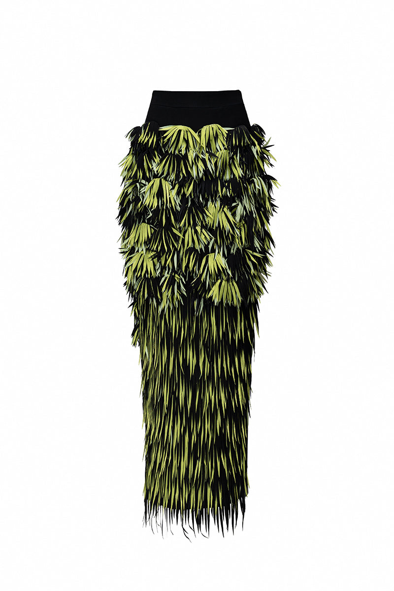 Green Jenny K Tran Retford Maxi Skirt with flowing fabric and elastic waistband, displayed on a hanger.