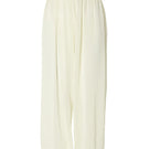 Studio NK Rianne Ivory pants featuring a relaxed fit, high waist, and lightweight fabric, shown on a model.