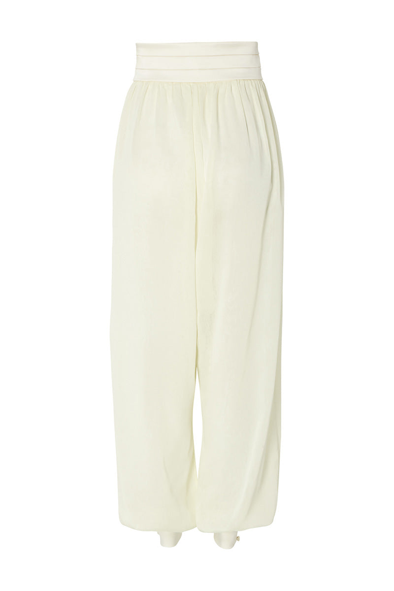 Studio NK Rianne ivory pants, tailored with a sleek fit, shown on a model, featuring a high waist and classic design.