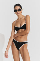 Black ribbed bikini top and bottom set by Seaquelle, featuring a textured ribbed fabric and classic swimwear style.