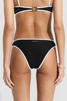 Black ribbed bikini top and bottom by Seaquelle, featuring a sleek, textured design perfect for beachwear and swim sessions.