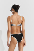 Black ribbed bikini top and bottom from Seaquelle, showcasing the textured fabric and classic swimwear style.
