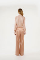 Nude Rida Stripe Shirt by Mastani, featuring classic striped pattern, button-down front, and collar, displayed on a hanger.