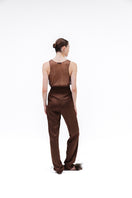 Brown Studio NK Rita tank top displayed on a hanger, showcasing its sleeveless design and casual fit.