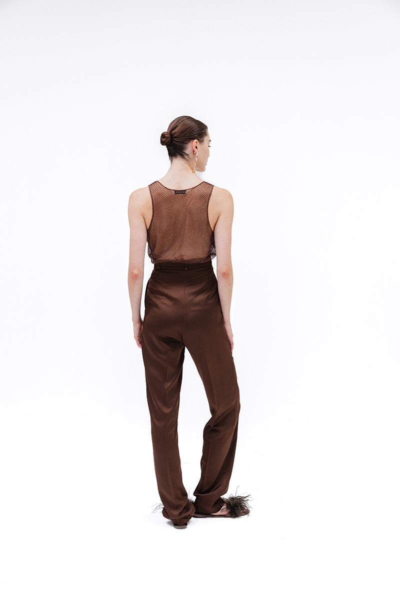 Brown Studio NK Rita tank top displayed on a hanger, showcasing its sleeveless design and casual fit.