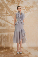 Rosee de Matin Melina asymmetric ruffled organza midi dress worn by a model, showcasing elegant ruffle details and flowing silhouette.