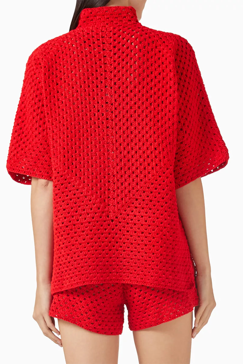 Red Jessica K ROSARA co-ords set with knitted fabric, featuring a fitted top and matching pants in a stylish, coordinated design.