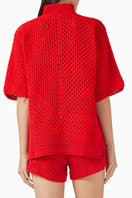 Red Jessica K ROSARA co-ords set with knitted fabric, featuring a fitted top and matching pants in a stylish, coordinated design.