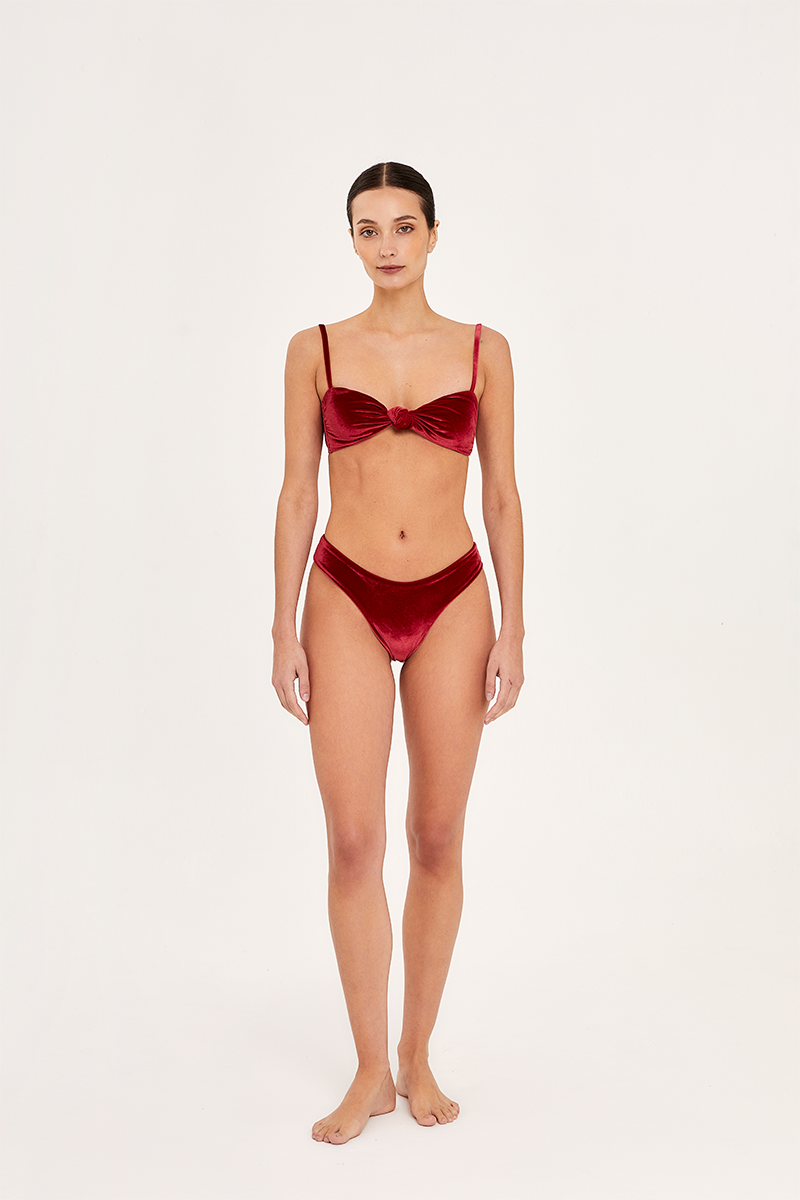 Red Aguaclara Rouge bandeau bikini top with adjustable straps, featuring a sleek, vibrant design perfect for beach or pool wear.