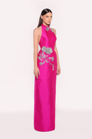 Elegant fuchsia ROVENA gown by Tarık Ediz featuring flowing fabric and intricate detailing, perfect for formal occasions.