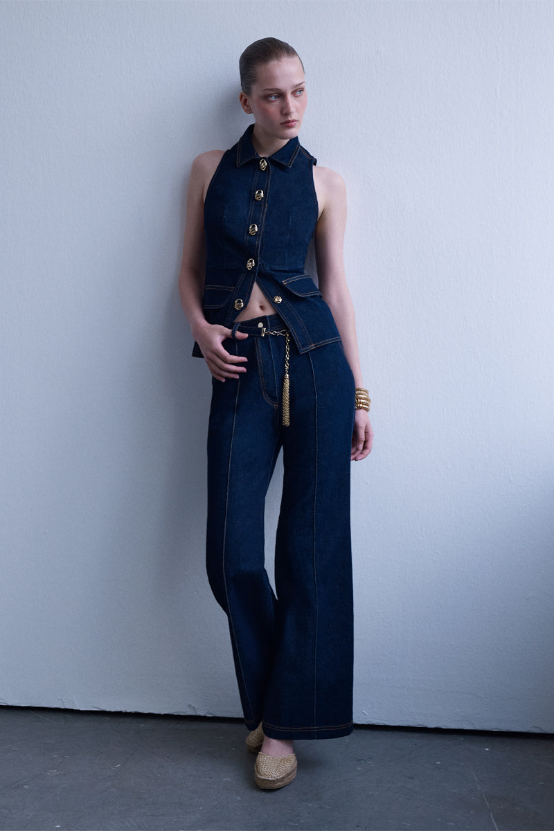 AISA Royce denim waist vest featuring classic denim fabric and a stylish fit, shown on a model with front pockets and button closure.