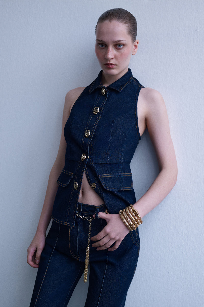 AISA Royce denim waist vest displayed on a hanger, featuring classic denim fabric with a sleeveless design and button closure.