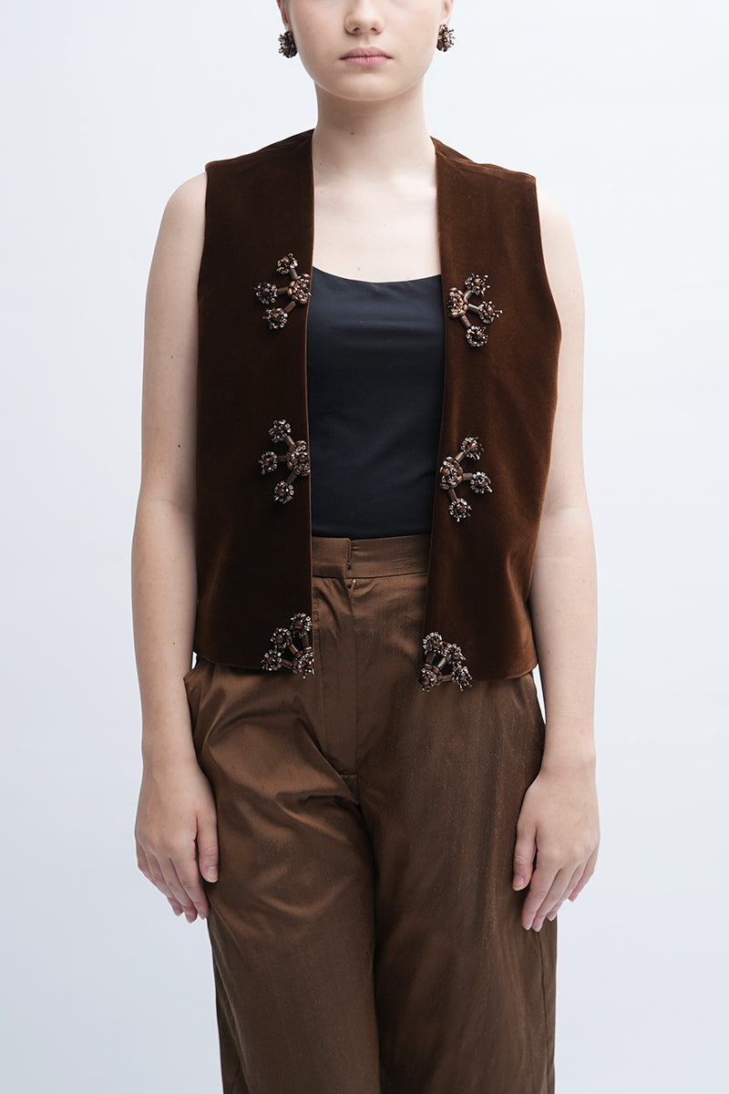 Aidan & Ice brown Isador vest displayed on a hanger, featuring a sleek design perfect for stylish layered outfits.