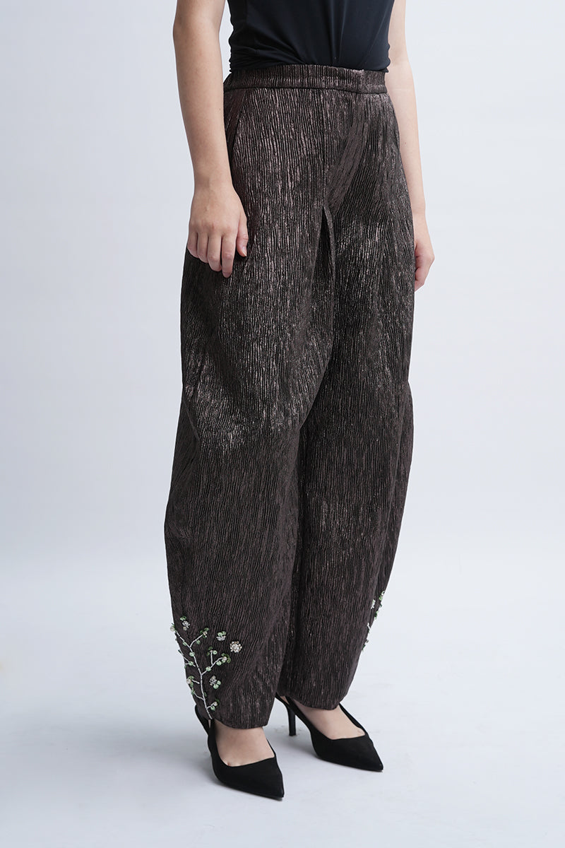 Aidan & Ice Louise pants in neutral fabric, shown on a model with a tailored fit, featuring a high waist and wide-leg style.