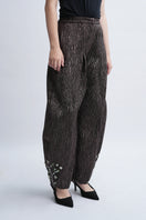 Aidan & Ice Louise pants in neutral fabric, shown on a model with a tailored fit, featuring a high waist and wide-leg style.