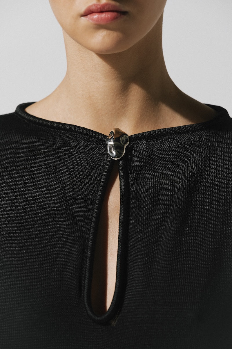 Black Ramila maxi dress by Baobab featuring a flowing silhouette and elegant design, shown on a model.