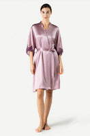 Front view of NK IMODE Raquel feminine silk kimono in mauve, midi-length lounge robe with elegant design and smooth fabric.