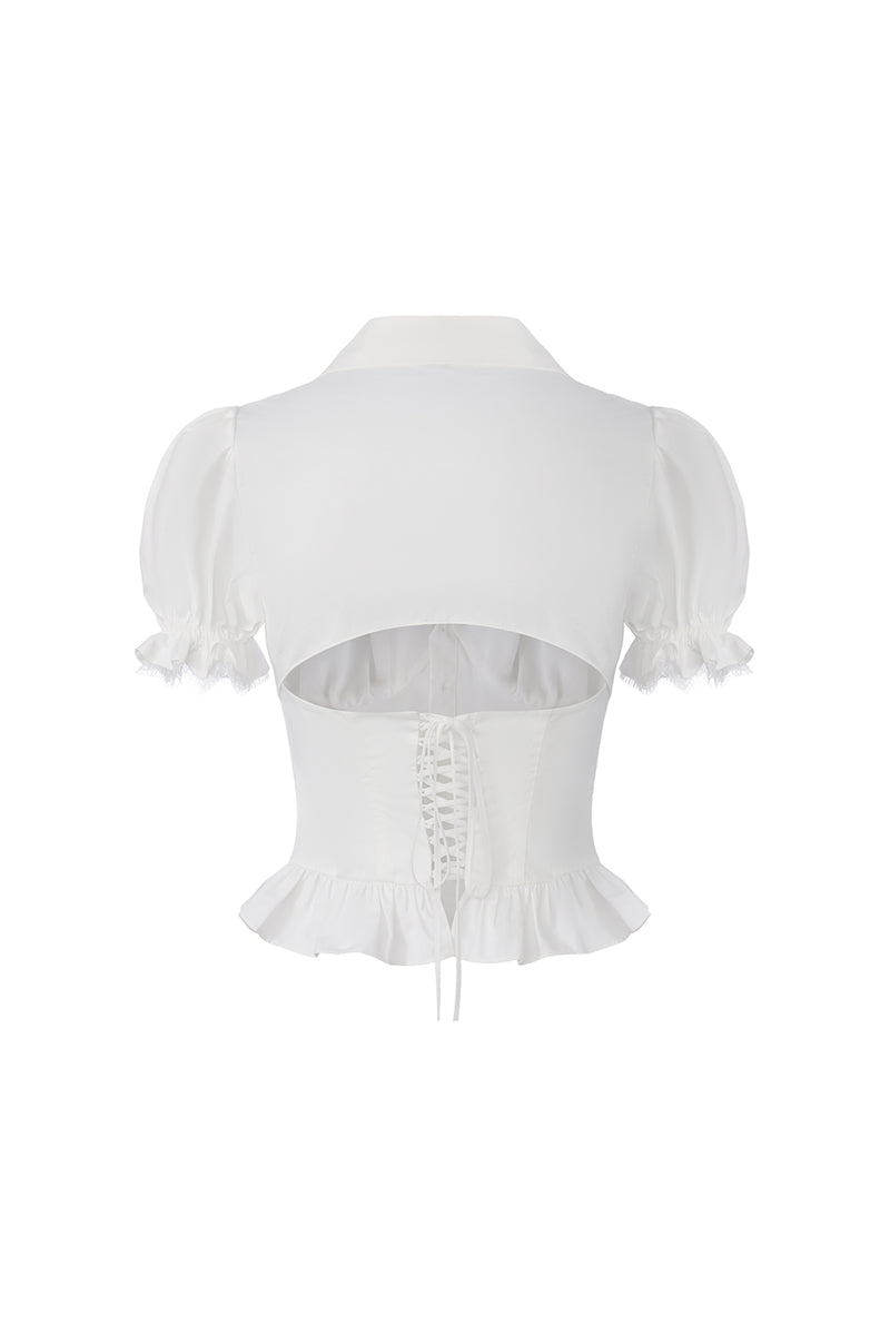 White Nana Jacqueline Raven top with puff sleeves, shown from the back, featuring stylish and comfortable design.