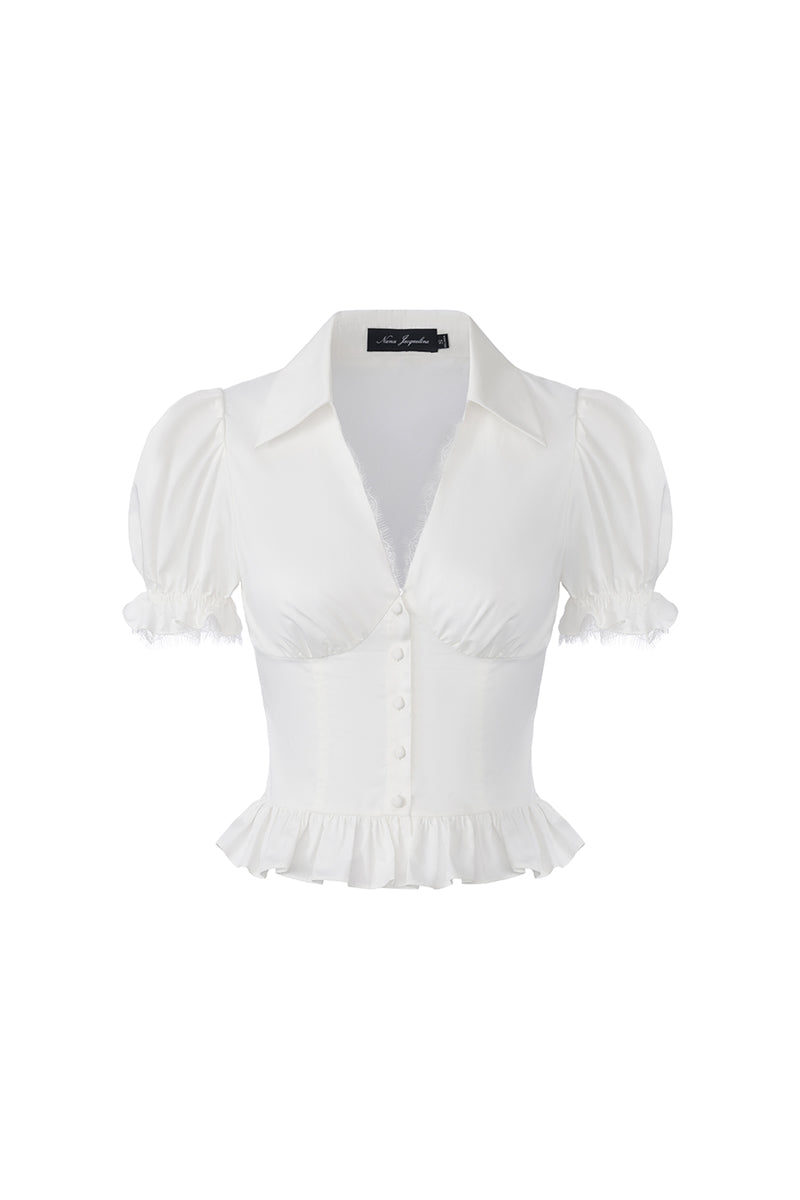 White Nana Jacqueline Raven puff sleeve top with stylish ruffle details, front view showing elegant and trendy design.