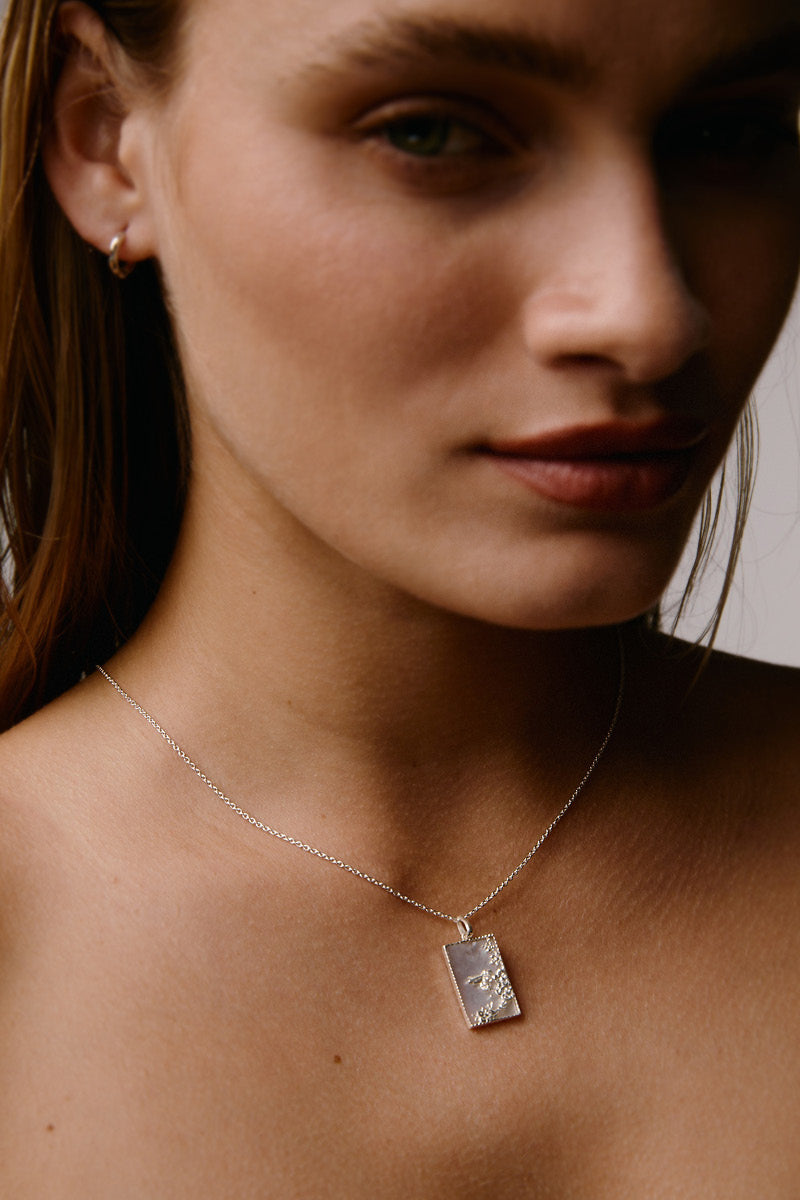 Sterling silver rectangle bee necklace by Freya Rose with a sleek, modern design, featuring a polished bee pendant on a delicate chain.