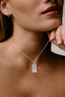 Sterling silver rectangle lion pendant necklace by Freya Rose, featuring a sleek rectangular lion design on a chain.