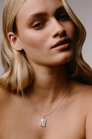 Sterling silver necklace featuring a rectangular pendant with a moon design, designed for women by Freya Rose.
