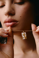 Gold vermeil rectangle woman and moon necklace by Freya Rose, featuring a sleek rectangular pendant and moon charm.
