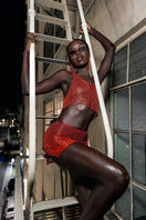 Red chain racerback top with built-in bralette by Natalia Fedner, featuring a sleek, fitted design and no-slip neckline.