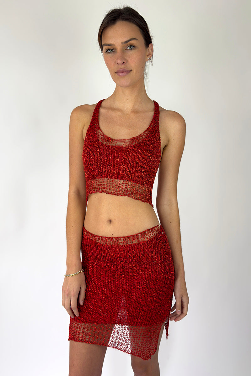 Red chain racerback top with bralette design by Natalia Fedner, shown from side view highlighting the vibrant red color and unique chain details.