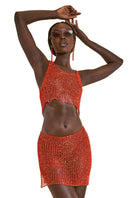 Red chain mini skirt with slip from Natalia Fedner, featuring a bold red color and metallic chain detailing.